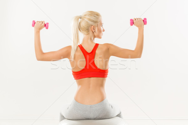 Rear View Of Young Women With Dumbbells Stock photo © MilanMarkovic78