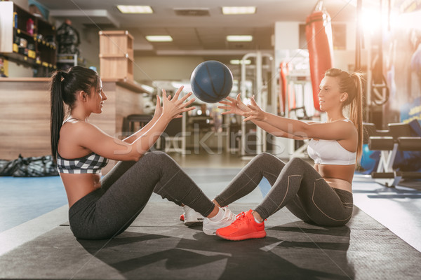 Two Girl Exercising At The Gym Stock photo © MilanMarkovic78