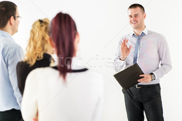 Happy Businessman Demonstrating his Project Stock photo © MilanMarkovic78
