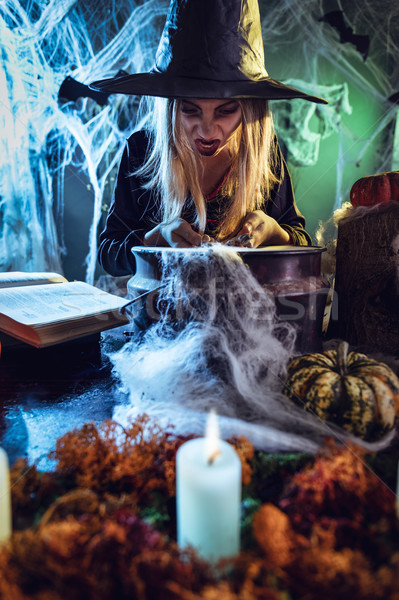 Young Witch Is Cooking With Magic Bones Stock photo © MilanMarkovic78