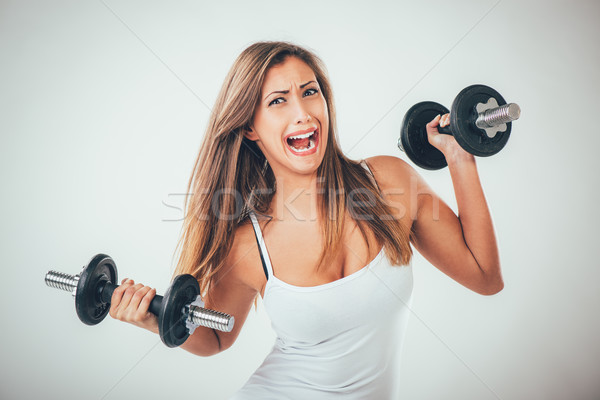 Fitness Woman Lifting Weights Stock photo © MilanMarkovic78