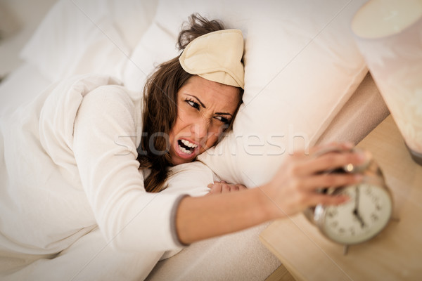 Virrasztás felfelé gyönyörű fiatal nő ágy tart Stock fotó © MilanMarkovic78