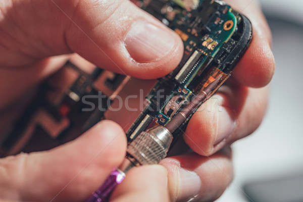 Man Repairing A Mobile phone Stock photo © MilanMarkovic78