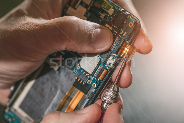 Man Repairing A Mobile phone Stock photo © MilanMarkovic78