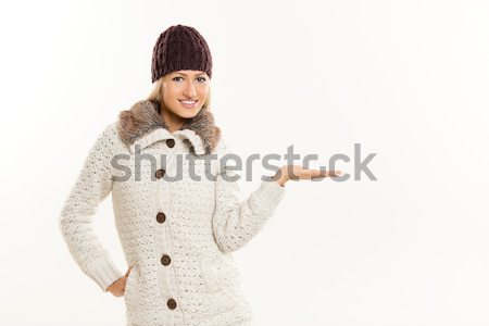 Blonde Girl In Winter Clothes, With Outstretched Palm Stock photo © MilanMarkovic78