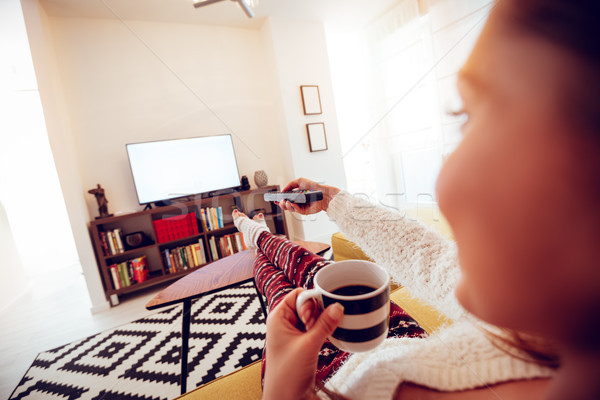 Regarder tv vue arrière belle jeune femme salon [[stock_photo]] © MilanMarkovic78