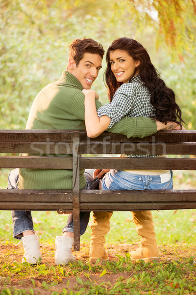 Young Smiling Couple On A Park Bench Stock photo © MilanMarkovic78