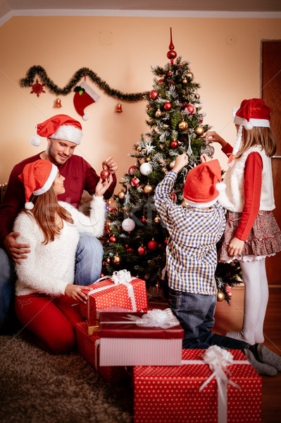 Család karácsonyfa gyönyörű boldog szülők gyerekek Stock fotó © MilanMarkovic78