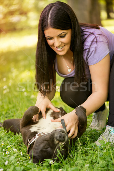 Girl Playing With Dog Stock photo © MilanMarkovic78