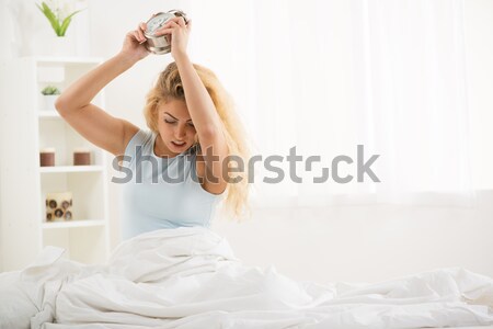 Felfelé aranyos fiatal nő ébredés reggel dühös Stock fotó © MilanMarkovic78