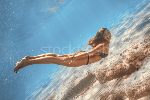 Mer belle jeunes femme souriante natation subaquatique [[stock_photo]] © MilanMarkovic78