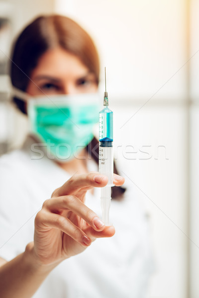 Vacinação jovem feminino enfermeira em pé consultor Foto stock © MilanMarkovic78