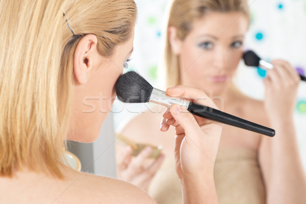 Beautiful woman applying blush Stock photo © MilanMarkovic78