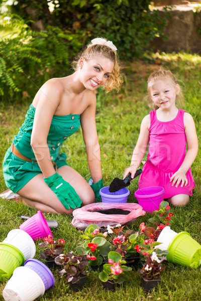 Mother and daughter planting flowers together Stock photo © MilanMarkovic78