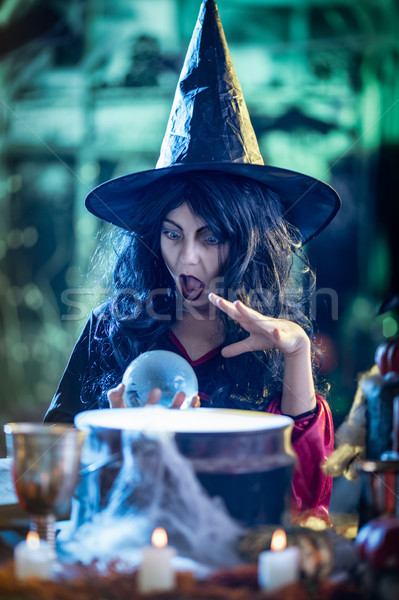 Young Witch Watching The Future In Magic Ball Stock photo © MilanMarkovic78