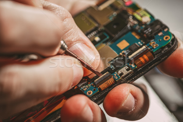 Man Repairing A Mobile phone Stock photo © MilanMarkovic78