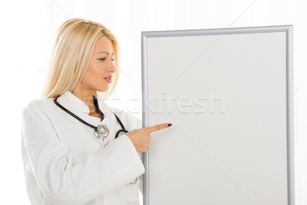 Female Doctor With Noticeboard Stock photo © MilanMarkovic78
