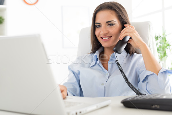 Business Woman Phoning In Office Stock photo © MilanMarkovic78
