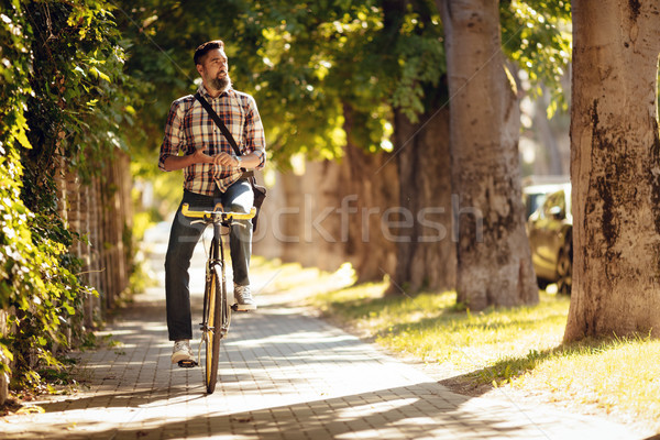 Handsome Man Riding Bicycle Stock photo © MilanMarkovic78