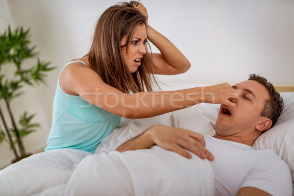 Horkolás heteroszexuális pár ágy férfi nyitott szájjal fáradt Stock fotó © MilanMarkovic78