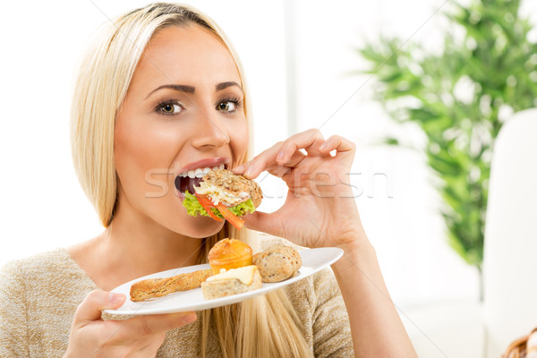 A Young Girl Eating Pastries Stock photo © MilanMarkovic78