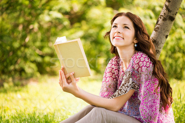 Girl with a book in the park Stock photo © MilanMarkovic78