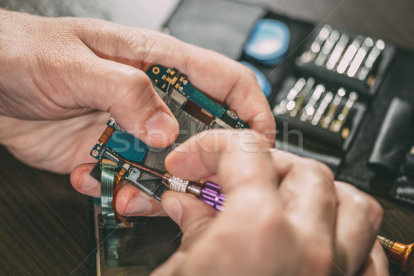 Man Repairing A Mobile phone Stock photo © MilanMarkovic78