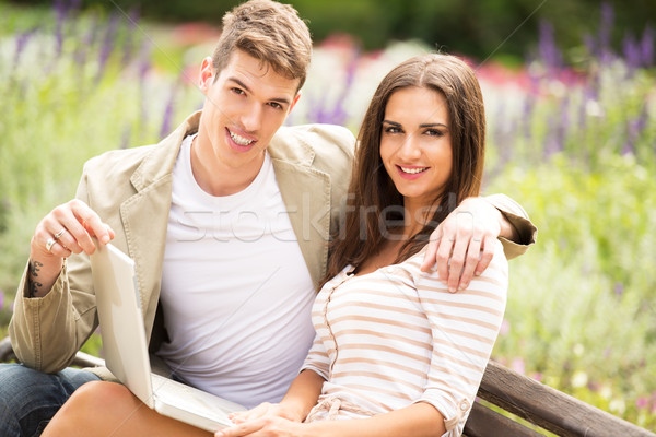 Young Couple In A Park With Laptop Stock photo © MilanMarkovic78