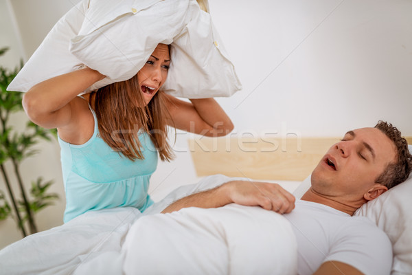 Horkolás heteroszexuális pár ágy férfi nyitott szájjal fáradt Stock fotó © MilanMarkovic78