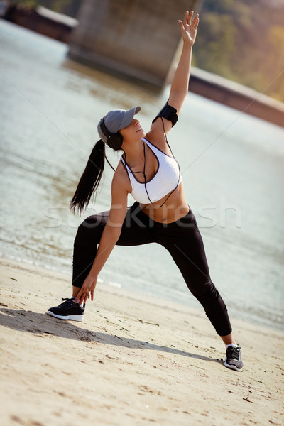 Stock photo: Cute Girl Exercising On The Beach