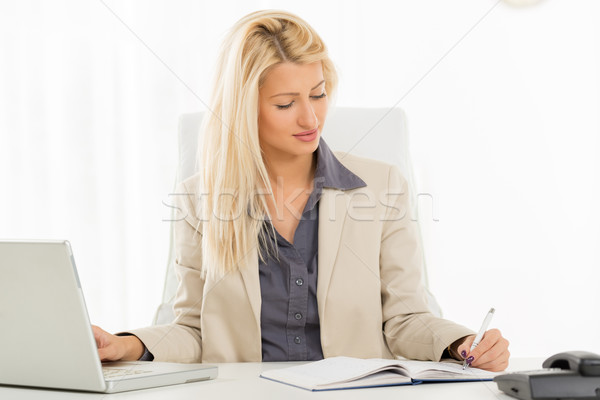 Left-Handed Businesswoman Stock photo © MilanMarkovic78