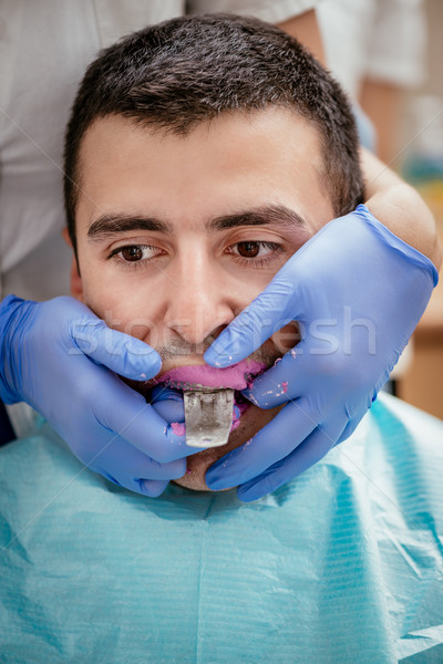 Zahnärztliche Eindruck Zahnarzt Hosenträger männlich Patienten Stock foto © MilanMarkovic78