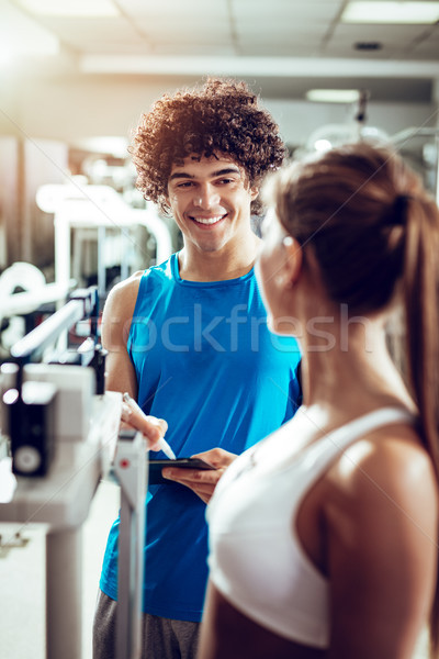 Dziewczyna konsultacje instruktor piękna muskularny fitness Zdjęcia stock © MilanMarkovic78