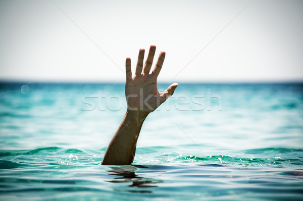Help mano uomo mare Foto d'archivio © MilanMarkovic78