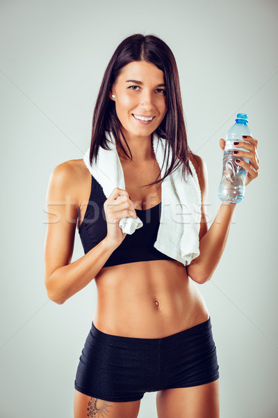 Fitness Girl With Bottle Of Water Stock photo © MilanMarkovic78