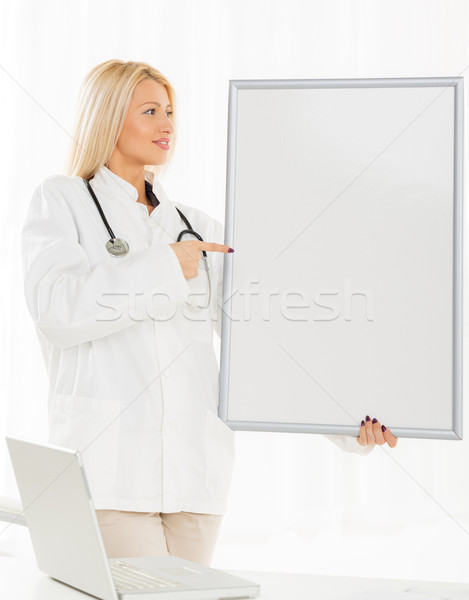 Female Doctor With Noticeboard Stock photo © MilanMarkovic78