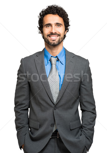 Portrait of a handsome businessman isolated on white Stock photo © Minervastock