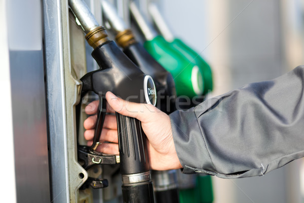 Man holding a fuel nozzle Stock photo © Minervastock