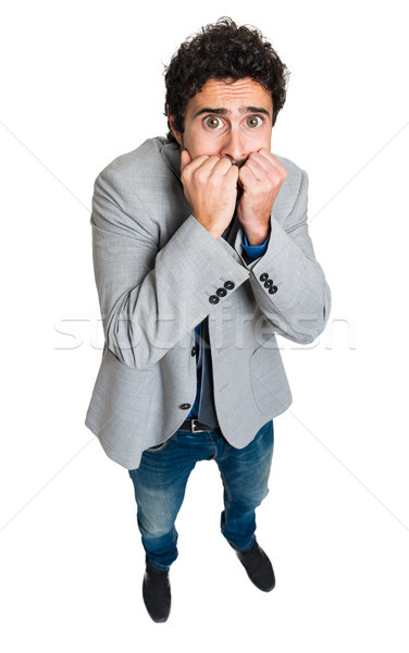Stock photo: Portrait of a businessman with a funny scared facial expression