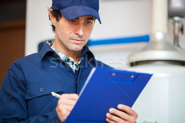 Technician servicing an hot-water heater Stock photo © Minervastock