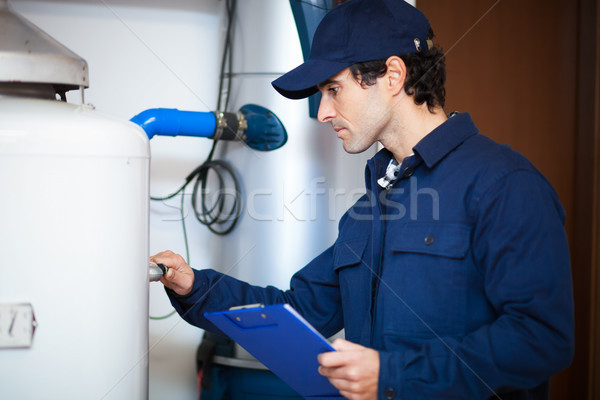 Souriant technicien chauffage eau heureux Photo stock © Minervastock