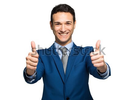 Businessman giving two thumbs up isolated on white background Stock photo © Minervastock
