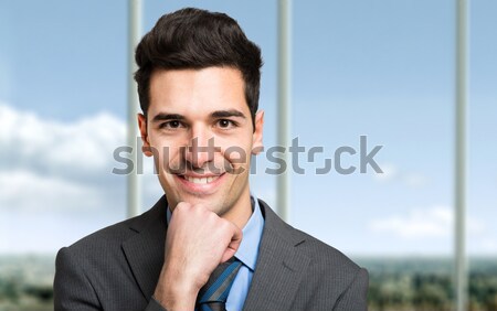 Pensieroso imprenditore isolato bianco ufficio uomo Foto d'archivio © Minervastock