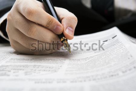 Stock photo: man signing a contract