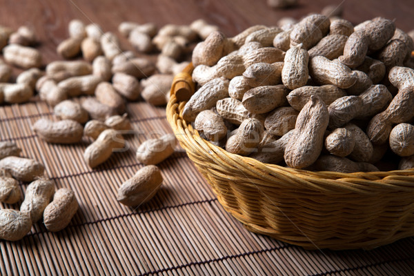large grains of peanuts in the shell and basket Stock photo © mizar_21984