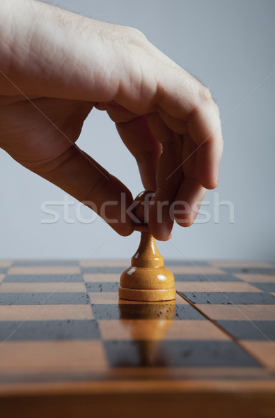 man makes a move chess pawn Stock photo © mizar_21984