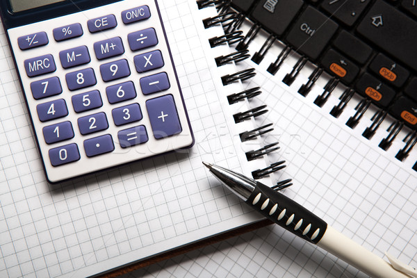 pen with calculator on a notebook and keyboard Stock photo © mizar_21984