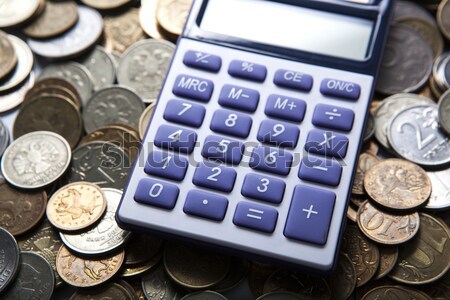 money in the form of coins with calculator Stock photo © mizar_21984