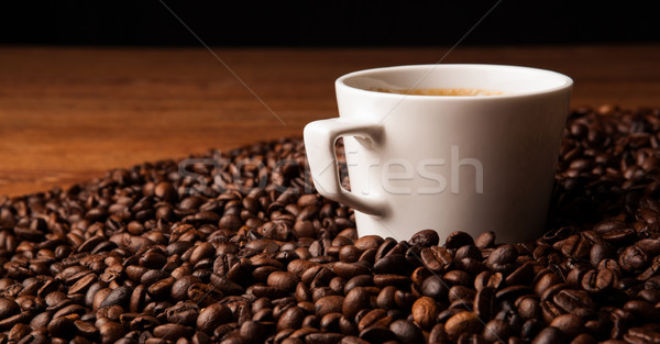 cup of black coffee with roasted coffe beans Stock photo © mizar_21984