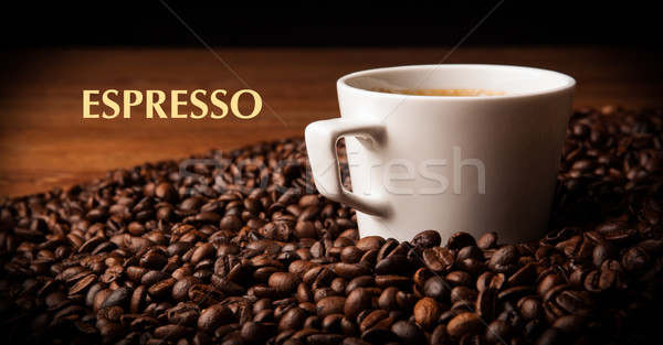 cup of black coffee with roasted coffe beans Stock photo © mizar_21984
